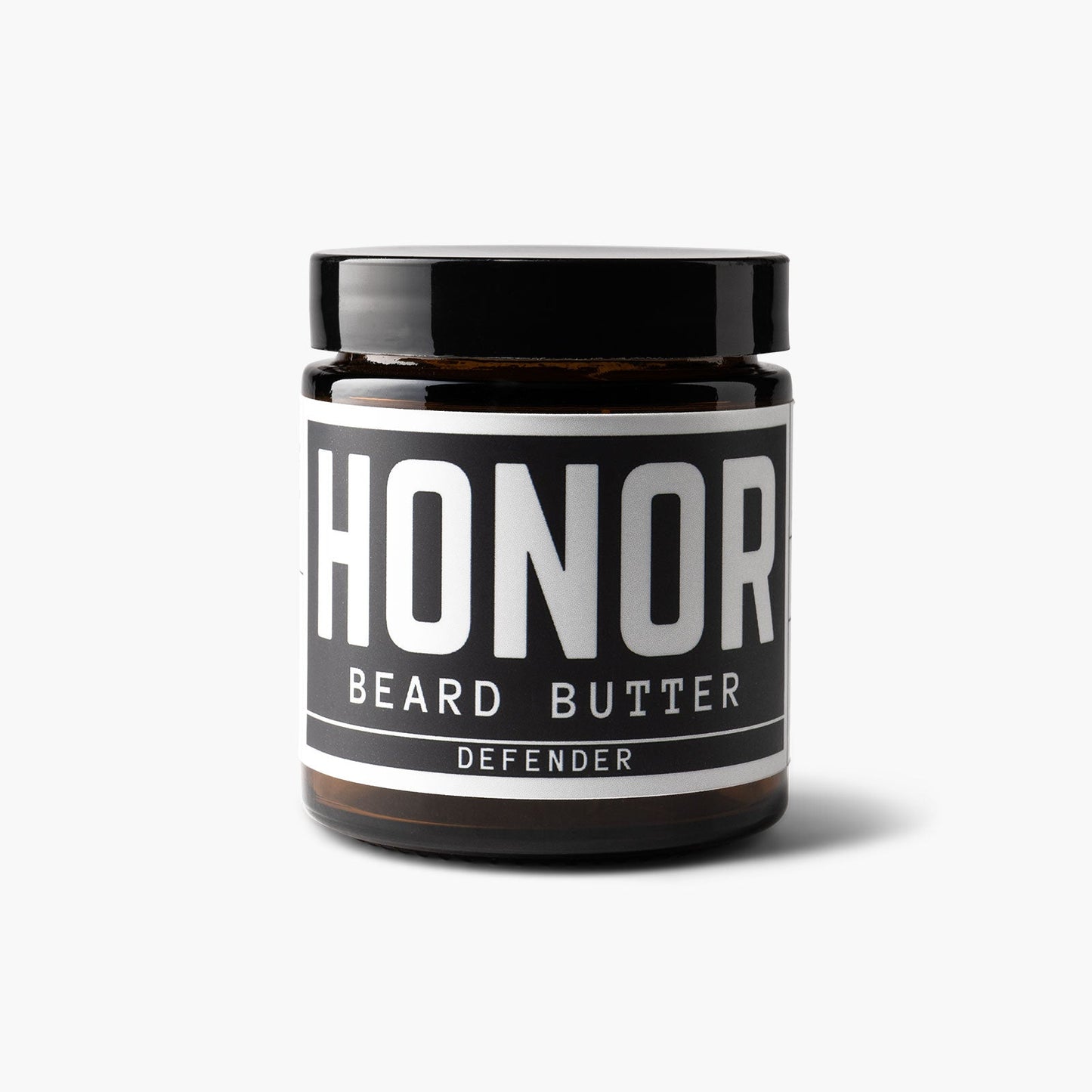 Defender blend beard butter on white background with a light shadow