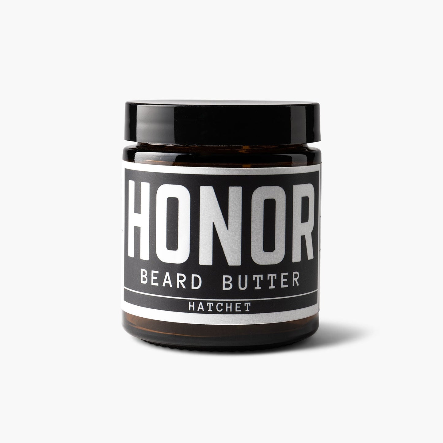 Hatchet blend beard butter on a white backdrop with a light shadow