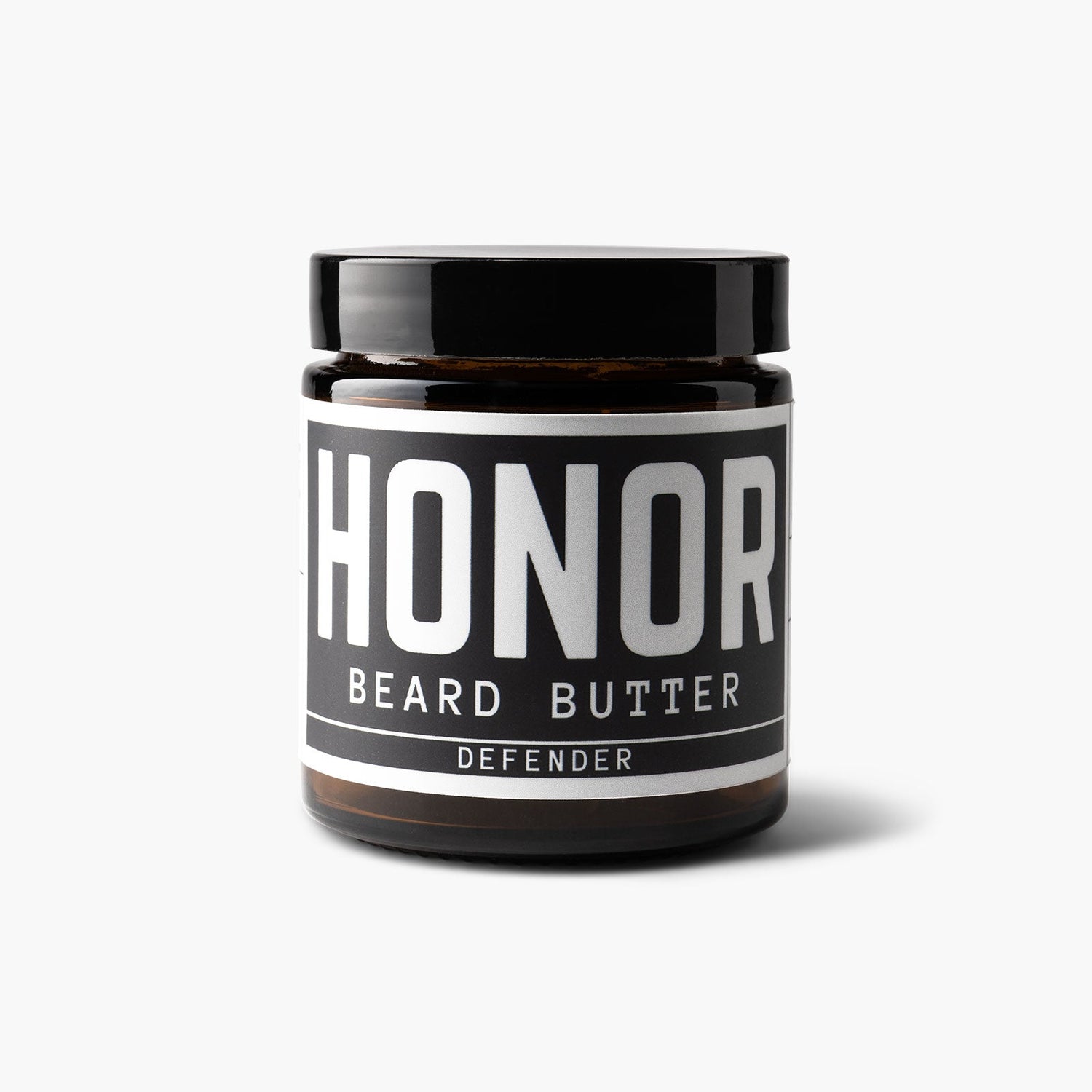 Defender blend beard butter on white background with a light shadow