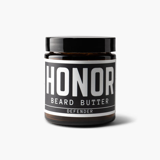 Defender blend beard butter on white background with a light shadow