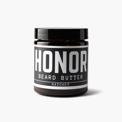 Hatchet blend beard butter on a white backdrop with a light shadow